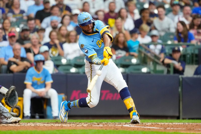 Jun 27, 2025; Milwaukee, Wisconsin, USA;  Milwaukee Brewers center fielder Jackson Chourio (11) hits a home run during the fourth inning against the Colorado Rockies at American Family Field. Mandatory Credit: Jeff Hanisch-Imagn Images