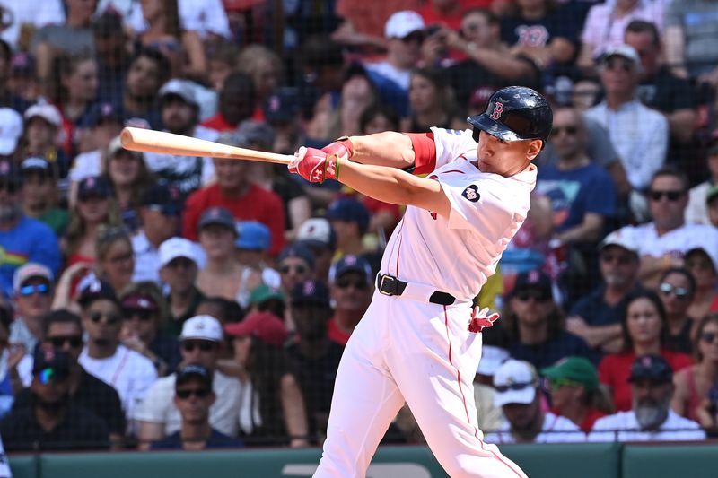 Aug 11, 2024; Boston, Massachusetts, USA; Boston Red Sox designated hitter Masataka Yoshida (7) hits an RBI single during the sixth inning against the Houston Astros at Fenway Park. Mandatory Credit: Eric Canha-USA TODAY Sports