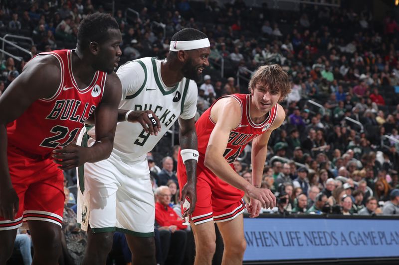 MILWAUKEE, WI - OCTOBER 14:  Adama Sanogo #21 and Matas Buzelis #14 of Chicago Bulls defends against Bobby Portis #9 of the Milwaukee Bucks on October 14, 2024 at Fiserv Forum Center in Milwaukee, Wisconsin. NOTE TO USER: User expressly acknowledges and agrees that, by downloading and or using this Photograph, user is consenting to the terms and conditions of the Getty Images License Agreement. Mandatory Copyright Notice: Copyright 2024 NBAE (Photo by Gary Dineen/NBAE via Getty Images).