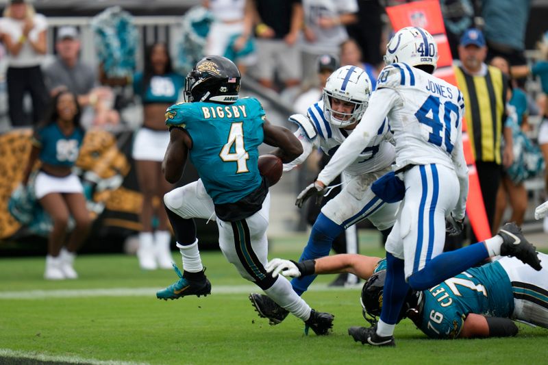 Jacksonville Jaguars' Tank Bigsby (4) goes in for a touchdown during the second half of an NFL football game against the Indianapolis Colts, Sunday, Oct. 6, 2024, in Jacksonville, Fla. (AP Photo/John Raoux)