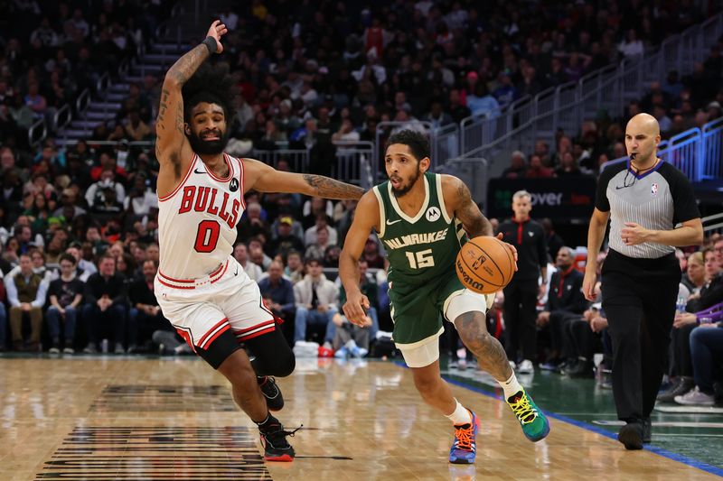 MILWAUKEE, WISCONSIN - DECEMBER 11: Cameron Payne #15 of the Milwaukee Bucks drives around Coby White #0 of the Chicago Bulls during a game at Fiserv Forum on December 11, 2023 in Milwaukee, Wisconsin. NOTE TO USER: User expressly acknowledges and agrees that, by downloading and or using this photograph, User is consenting to the terms and conditions of the Getty Images License Agreement. (Photo by Stacy Revere/Getty Images)