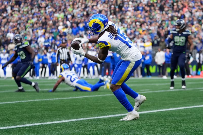 Los Angeles Rams wide receiver Demarcus Robinson (15) catches a touchdown pass against the Seattle Seahawks during the second half of an NFL football game in Seattle, Sunday, Nov. 3, 2024. (AP Photo/Lindsey Wasson)