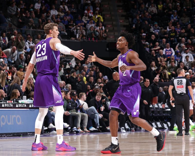 SALT LAKE CITY, UT - NOVEMBER 23: Lauri Markkanen #23 and Collin Sexton #2 of the Utah Jazz high five during the game against the New York Knicks on November 23, 2024 at Delta Center in Salt Lake City, Utah. NOTE TO USER: User expressly acknowledges and agrees that, by downloading and or using this Photograph, User is consenting to the terms and conditions of the Getty Images License Agreement. Mandatory Copyright Notice: Copyright 2024 NBAE (Photo by Melissa Majchrzak/NBAE via Getty Images)