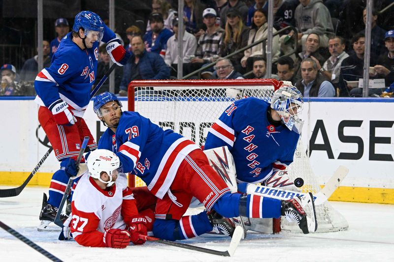 Oct 14, 2024; New York, New York, USA;  New York Rangers goaltender Igor Shesterkin (31) makes a save against the Detroit Red Wings during the second period at Madison Square Garden. Mandatory Credit: Dennis Schneidler-Imagn Images