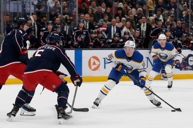 Jan 3, 2026; Columbus, Ohio, USA; Buffalo Sabres center Noah Ostlund (86) looks to shoot as Columbus Blue Jackets defenseman Denton Mateychuk (5) defends during the first period at Nationwide Arena. Mandatory Credit: Russell LaBounty-Imagn Images