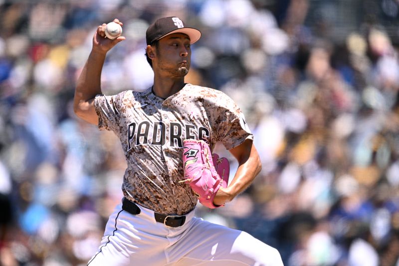 May 12, 2024; San Diego, California, USA; San Diego Padres starting pitcher Yu Darvish (11) throws a pitch against the Los Angeles Dodgers during the first inning at Petco Park. Mandatory Credit: Orlando Ramirez-USA TODAY Sports