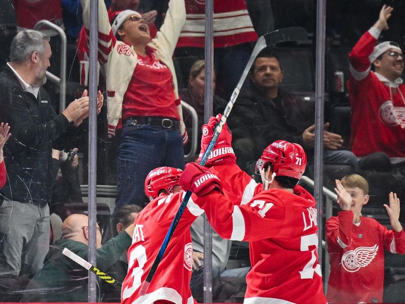 Nov 27, 2024; Detroit, Michigan, USA; Detroit Red Wings right wing Alex DeBrincat (93) celebrates his goal with center Dylan Larkin (71) during the first period against the Calgary Flames at Little Caesars Arena. Mandatory Credit: Tim Fuller-Imagn Images