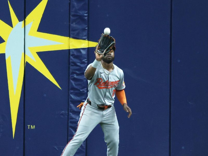 Jun 10, 2024; St. Petersburg, Florida, USA; Baltimore Orioles outfielder Cedric Mullins (31) catches a fly ball during the sixth inning against the Tampa Bay Rays at Tropicana Field. Mandatory Credit: Kim Klement Neitzel-USA TODAY Sports