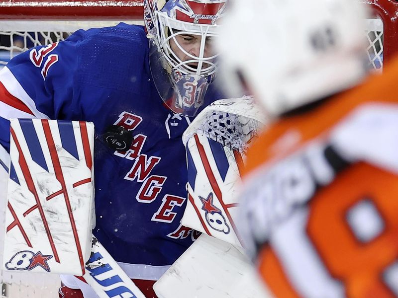 Mar 26, 2024; New York, New York, USA; New York Rangers goaltender Igor Shesterkin (31) makes a save against Philadelphia Flyers center Morgan Frost (48) during the second period at Madison Square Garden. Mandatory Credit: Brad Penner-USA TODAY Sports