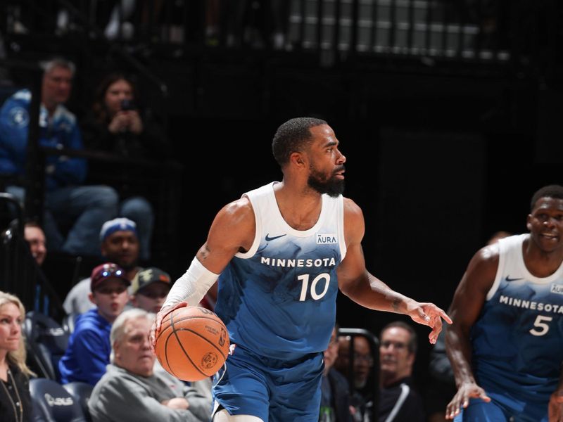 MINNEAPOLIS, MN -  APRIL 9: Mike Conley #10 of the Minnesota Timberwolves handles the ball during the game against the Washington Wizards on April 9, 2024 at Target Center in Minneapolis, Minnesota. NOTE TO USER: User expressly acknowledges and agrees that, by downloading and or using this Photograph, user is consenting to the terms and conditions of the Getty Images License Agreement. Mandatory Copyright Notice: Copyright 2024 NBAE (Photo by David Sherman/NBAE via Getty Images)