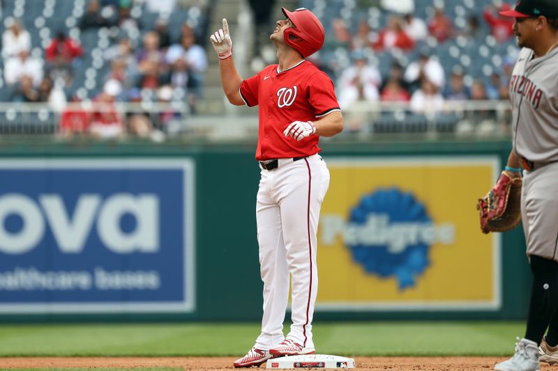 Apr 6, 2025; Washington, District of Columbia, USA; Washington Nationals shortstop Paul DeJong (14) celebrates after hitting a double during the second inning against the Arizona Diamondbacks at Nationals Park. Mandatory Credit: Daniel Kucin Jr.-Imagn Images