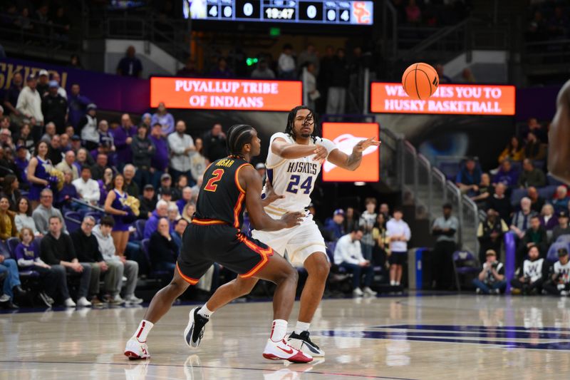 Mar 4, 2026; Seattle, Washington, USA; Washington Huskies center Lathan Sommerville (24) passes the ball while guarded by Southern California Trojans forward Ezra Ausar (2) during the first half at Alaska Airlines Arena at Hec Edmundson Pavilion. Mandatory Credit: Steven Bisig-Imagn Images
