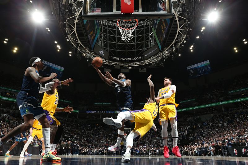 MINNEAPOLIS, MN -  APRIL 25:   Anthony Edwards #5 of the Minnesota Timberwolves drives to the basket during the game against the Los Angeles Lakers  during Round 1 Game 3 of the 2025 NBA Playoffs  on April 25, 2025 at Target Center in Minneapolis, Minnesota. NOTE TO USER: User expressly acknowledges and agrees that, by downloading and or using this Photograph, user is consenting to the terms and conditions of the Getty Images License Agreement. Mandatory Copyright Notice: Copyright 2025 NBAE (Photo by David Sherman/NBAE via Getty Images)