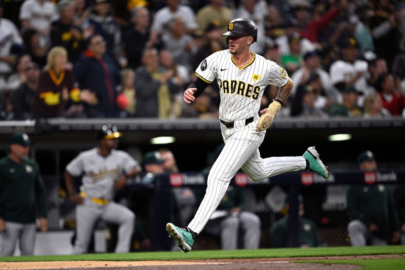 Jun 10, 2024; San Diego, California, USA; San Diego Padres center fielder Jackson Merrill (3) advances home to score a run against the Oakland Athletics during the fourth inning at Petco Park. Mandatory Credit: Orlando Ramirez-USA TODAY Sports