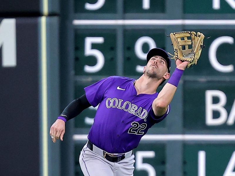 Jun 26, 2024; Houston, Texas, USA; Colorado Rockies left fielder Nolan Jones (22) catches a fly ball for an out against the Houston Astros during the fourth inning at Minute Maid Park. Mandatory Credit: Erik Williams-USA TODAY Sports