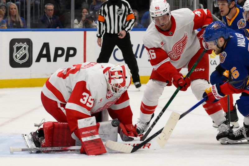 Apr 1, 2025; St. Louis, Missouri, USA; Detroit Red Wings goaltender Cam Talbot (39) and defenseman Jeff Petry (46) defend the net form St. Louis Blues left wing Nathan Walker (26) during the second period at Enterprise Center. Mandatory Credit: Jeff Le-Imagn Images
