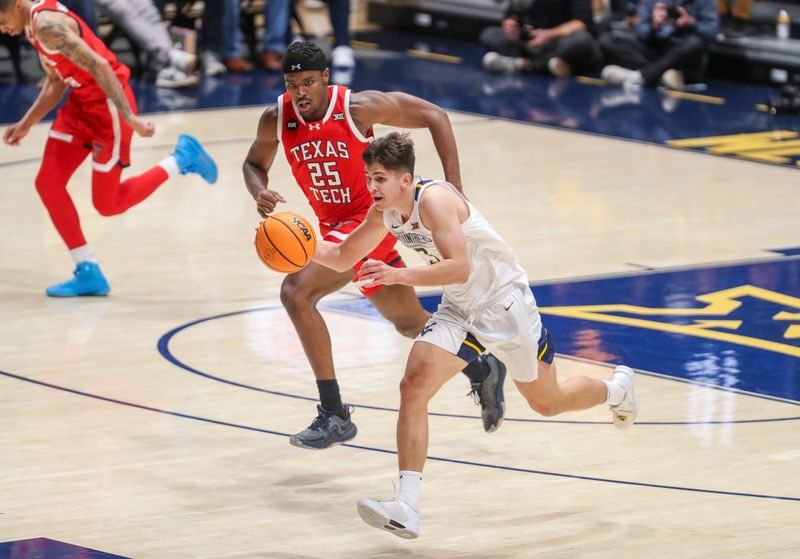 Mar 2, 2024; Morgantown, West Virginia, USA; West Virginia Mountaineers guard Kerr Kriisa (3) dribbles up the floor during the first half against the Texas Tech Red Raiders at WVU Coliseum. Mandatory Credit: Ben Queen-USA TODAY Sports