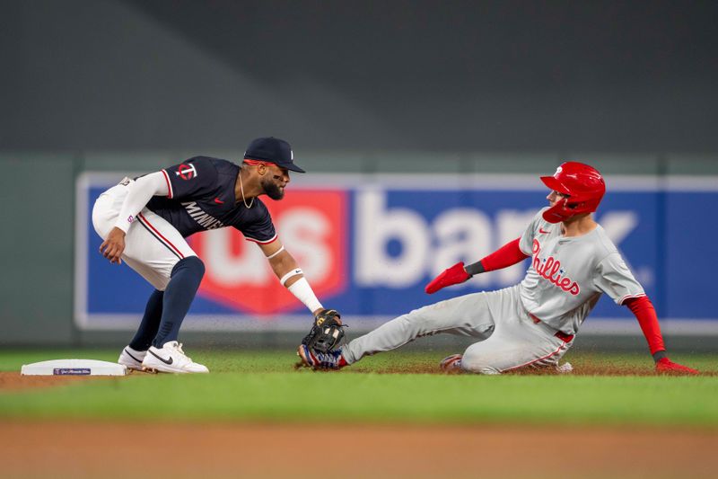 Jul 22, 2024; Minneapolis, Minnesota, USA; Minnesota Twins shortstop Willi Castro (50) tags out Philadelphia Phillies shortstop Trea Turner (7) for a double play in the sixth inning at Target Field. Mandatory Credit: Jesse Johnson-USA TODAY Sports