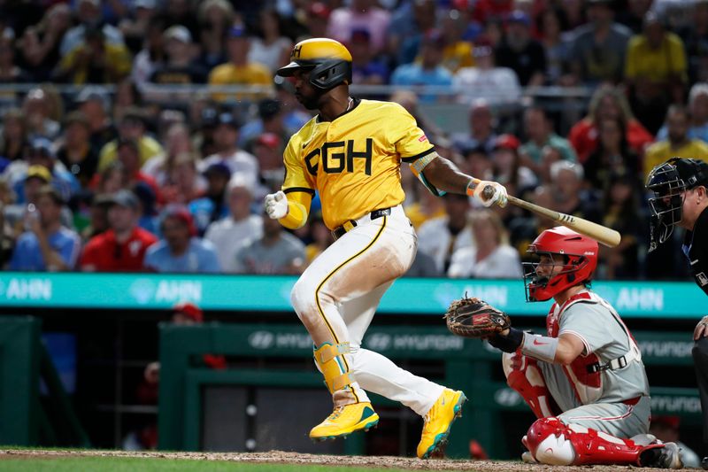 Jul 19, 2024; Pittsburgh, Pennsylvania, USA;  Pittsburgh Pirates designated hitter Andrew McCutchen (22) hits a single against the Philadelphia Phillies during the seventh inning at PNC Park. Mandatory Credit: Charles LeClaire-USA TODAY Sports