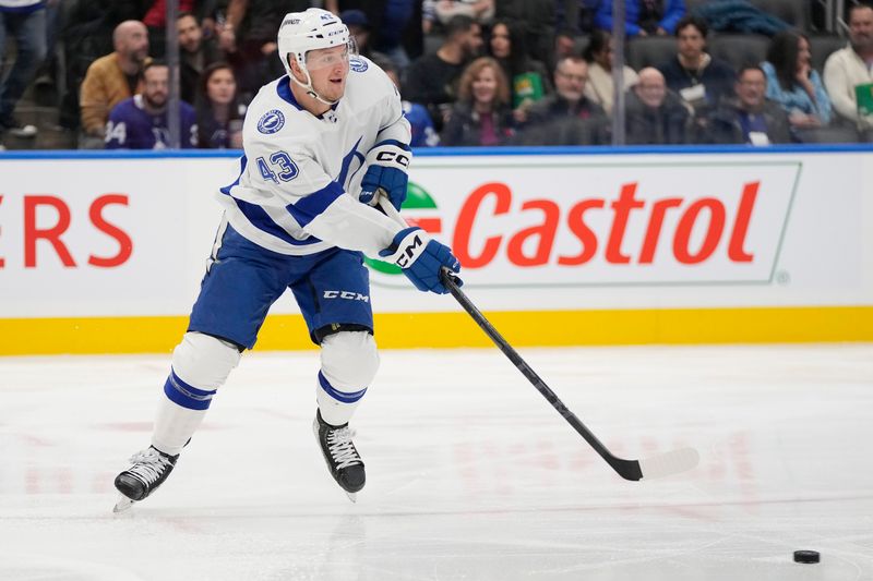 Nov 6, 2023; Toronto, Ontario, CAN; Tampa Bay Lightning defenseman Darren Raddysh (43) passes the puck against the Toronto Maple Leafs during the first period at Scotiabank Arena. Mandatory Credit: John E. Sokolowski-USA TODAY Sports