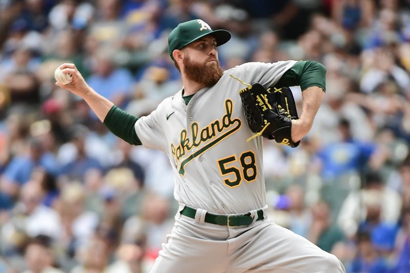 Jun 10, 2023; Milwaukee, Wisconsin, USA; Oakland Athletes pitcher Paul Blackburn (58) pitches against the Milwaukee Brewers in the first inning at American Family Field. Mandatory Credit: Benny Sieu-USA TODAY Sports