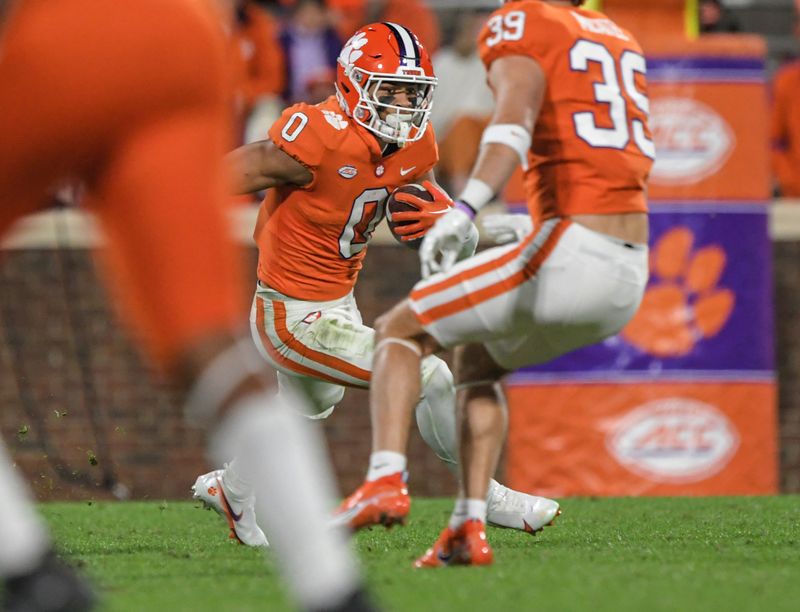 Nov 19, 2022; Clemson, South Carolina, USA; Clemson Tigers wide receiver Antonio Williams(0) runs after a catch against the Miami Hurricanes during the third quarter at Memorial Stadium. Mandatory Credit: Ken Ruinard-USA TODAY Sports