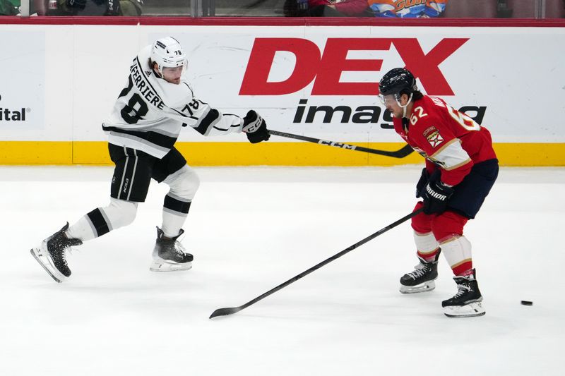 Jan 11, 2024; Sunrise, Florida, USA; Los Angeles Kings right wing Alex Laferriere (78) shoots the puck on Florida Panthers defenseman Brandon Montour (62) during the first period at Amerant Bank Arena. Mandatory Credit: Jasen Vinlove-USA TODAY Sports