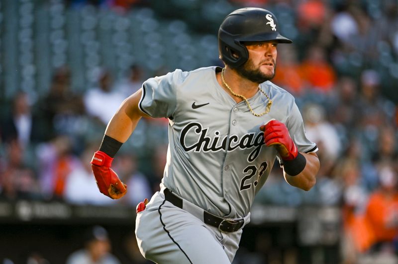 Sep 3, 2024; Baltimore, Maryland, USA;  Chicago White Sox outfielder Andrew Benintendi (23) runs out a first inning double against the Baltimore Orioles at Oriole Park at Camden Yards. Mandatory Credit: Tommy Gilligan-Imagn Images