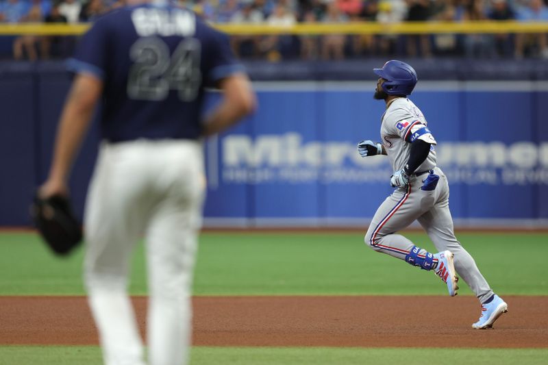 Oct 4, 2023; St. Petersburg, Florida, USA; Texas Rangers right fielder Adolis Garcia (53) runs around the bases after hitting a solo home run against the Tampa Bay Rays in the fourth inning during game two of the Wildcard series for the 2023 MLB playoffs at Tropicana Field. Mandatory Credit: Nathan Ray Seebeck-USA TODAY Sports