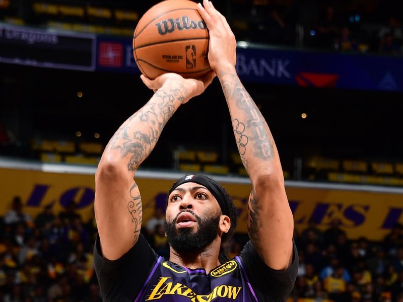 LOS ANGELES, CA - JANUARY 13: Anthony Davis #3 of the Los Angeles Lakers shoots a free throw during the game against the San Antonio Spurs on January 13, 2025 at Crypto.Com Arena in Los Angeles, California. NOTE TO USER: User expressly acknowledges and agrees that, by downloading and/or using this Photograph, user is consenting to the terms and conditions of the Getty Images License Agreement. Mandatory Copyright Notice: Copyright 2025 NBAE (Photo by Adam Pantozzi/NBAE via Getty Images)