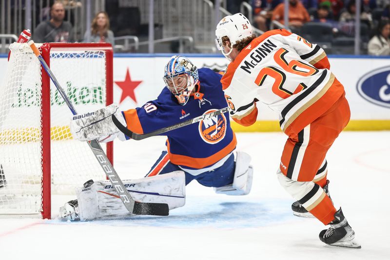 Oct 29, 2024; Elmont, New York, USA; New York Islanders goaltender Ilya Sorokin (30) makes a save on a shot on goal attempt by Anaheim Ducks left wing Brock McGinn (26) in the first period at UBS Arena. Mandatory Credit: Wendell Cruz-Imagn Images