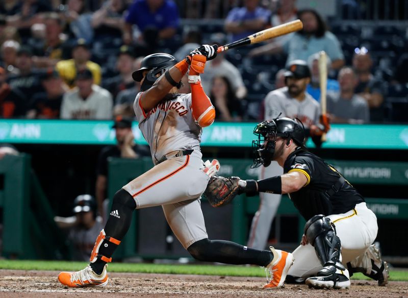May 22, 2024; Pittsburgh, Pennsylvania, USA;  San Francisco Giants center fielder Luis Matos (29) hits an RBI single against the Pittsburgh Pirates during the tenth inning at PNC Park. The Giants won 9-5 in ten innings. Mandatory Credit: Charles LeClaire-USA TODAY Sports