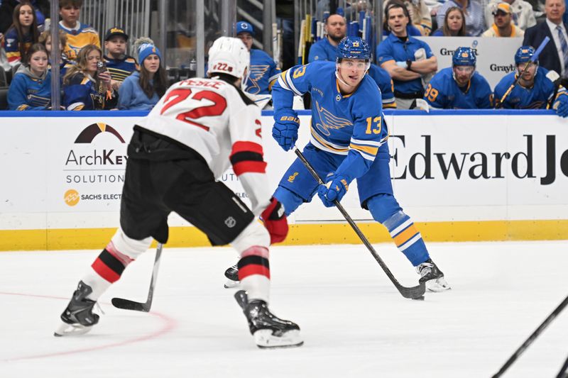 Feb 28, 2026; St. Louis, Missouri, USA; New Jersey Devils defenseman Brett Pesce (22) defends against St. Louis Blues right wing Alexey Toropchenko (13) in the second period at Enterprise Center. Mandatory Credit: Joe Puetz-Imagn Images