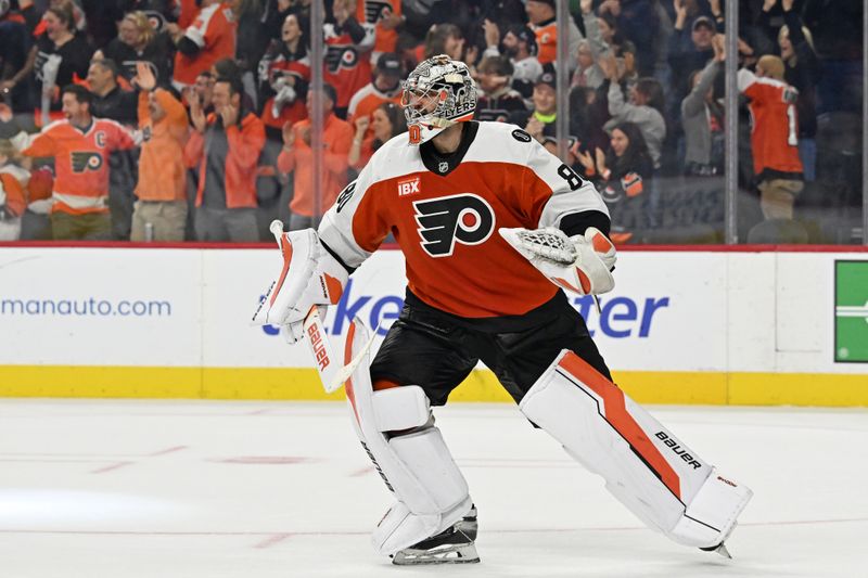 Oct 18, 2025; Philadelphia, Pennsylvania, USA; Philadelphia Flyers goaltender Dan Vladar (80) celebrates win against the Minnesota Wild in overtime at Wells Fargo Center. Mandatory Credit: Eric Hartline-Imagn Images