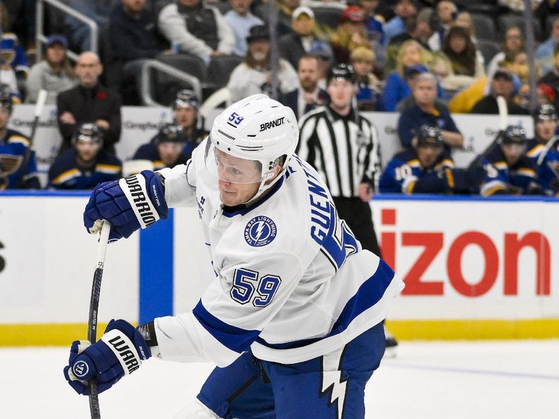 Nov 5, 2024; St. Louis, Missouri, USA;  Tampa Bay Lightning center Jake Guentzel (59) shoots against the St. Louis Blues during the first period at Enterprise Center. Mandatory Credit: Jeff Curry-Imagn Images