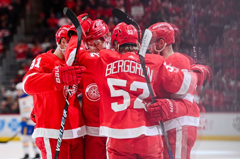 Apr 6, 2023; Detroit, Michigan, USA; Detroit Red Wings defenseman Simon Edvinsson (3) celebrates his goal with teammates during the second period against the Buffalo Sabres at Little Caesars Arena. Mandatory Credit: Tim Fuller-USA TODAY Sports