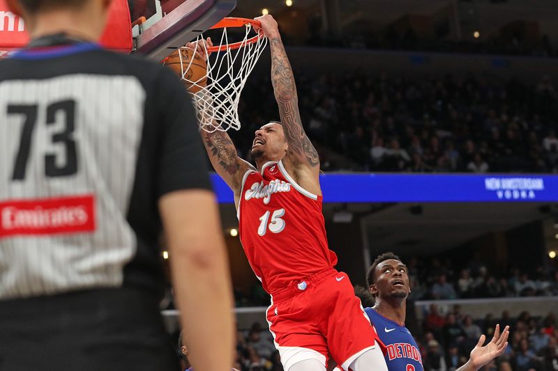 MEMPHIS, TENNESSEE - NOVEMBER 27: Brandon Clarke #15 of the Memphis Grizzlies goes to the basket against Jalen Duren #0 of the Detroit Pistons during the second half at FedExForum on November 27, 2024 in Memphis, Tennessee. NOTE TO USER: User expressly acknowledges and agrees that, by downloading and or using this photograph, User is consenting to the terms and conditions of the Getty Images License Agreement. (Photo by Justin Ford/Getty Images)
