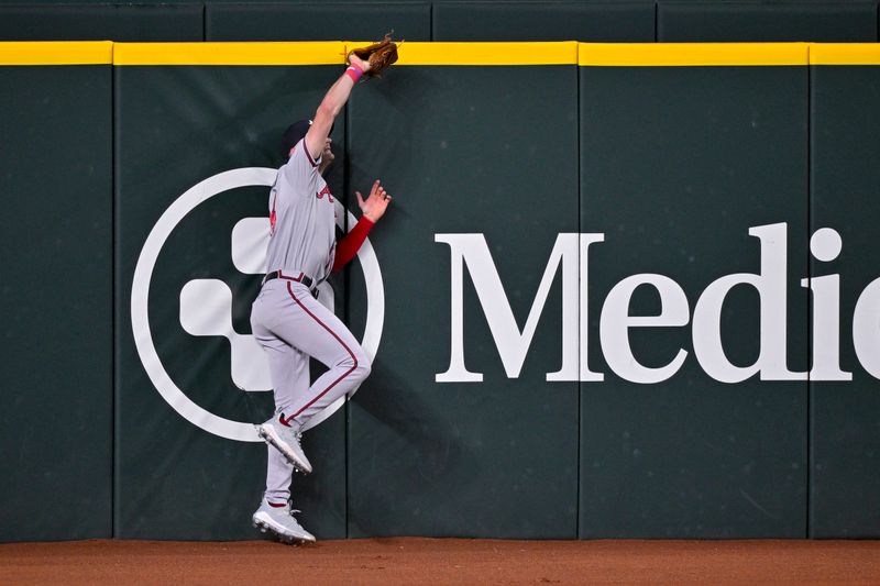 May 16, 2023; Arlington, Texas, USA; Atlanta Braves left fielder Sam Hilliard (14) catches a fly ball hit by Texas Rangers shortstop Ezequiel Duran (not pictured) during the sixth inning at Globe Life Field. Mandatory Credit: Jerome Miron-USA TODAY Sports