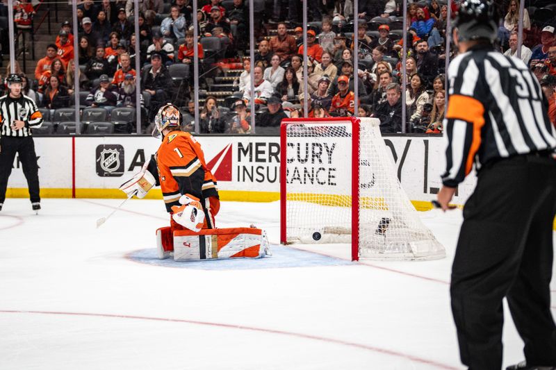 Mar 1, 2026; Anaheim, California, USA; Calgary Flames score against Anaheim Ducks goaltender Lukas Dostal (1) during overtime at Honda Center. Mandatory Credit: Corinne Votaw-Imagn Images