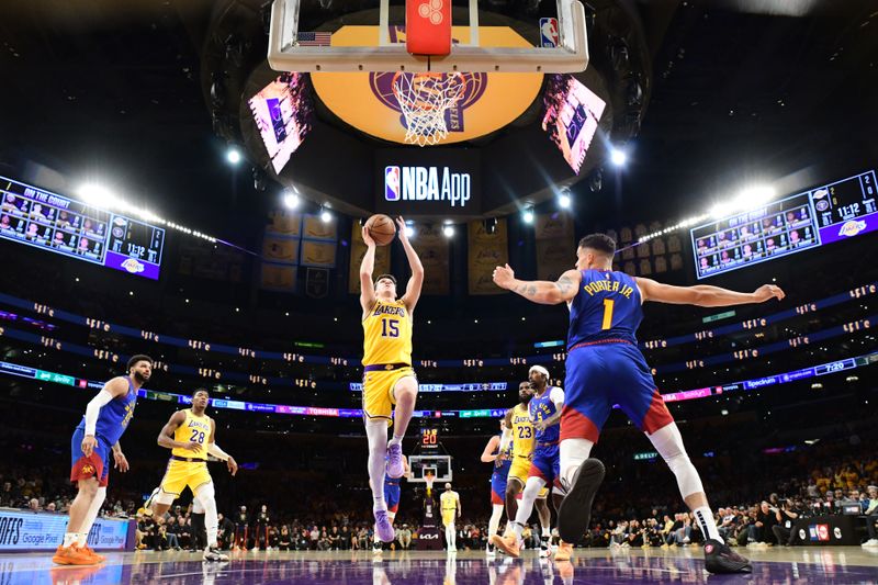 LOS ANGELES, CA - APRIL 25: Austin Reaves #15 of the Los Angeles Lakers drives to the basket during the game against the Denver Nuggets during Round One Game Three of the 2024 NBA Playoffs on April 25, 2024 at Crypto.Com Arena in Los Angeles, California. NOTE TO USER: User expressly acknowledges and agrees that, by downloading and/or using this Photograph, user is consenting to the terms and conditions of the Getty Images License Agreement. Mandatory Copyright Notice: Copyright 2024 NBAE (Photo by Adam Pantozzi/NBAE via Getty Images)