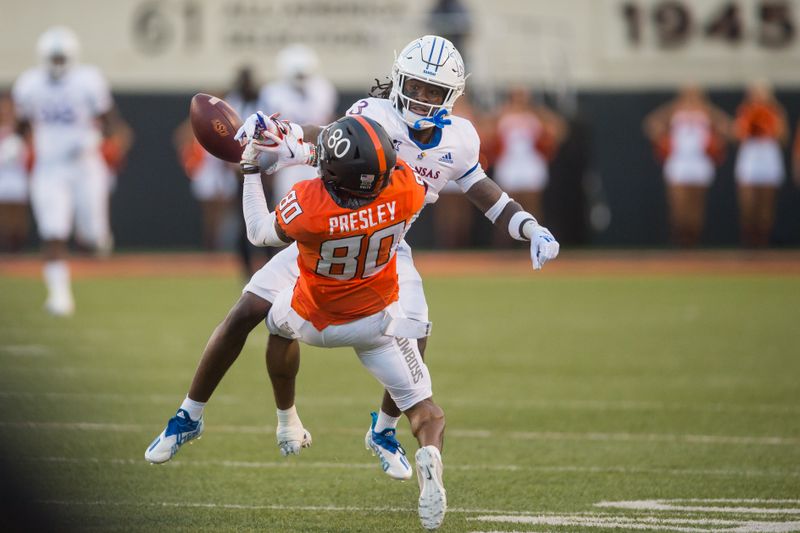 Oct 30, 2021; Stillwater, Oklahoma, USA;  Kansas Jayhawks safety Ricky Thomas Jr. (3) is called for pass interference against Oklahoma State Cowboys wide receiver Brennan Presley (80) during the first quarter at Boone Pickens Stadium. Mandatory Credit: Brett Rojo-USA TODAY Sports