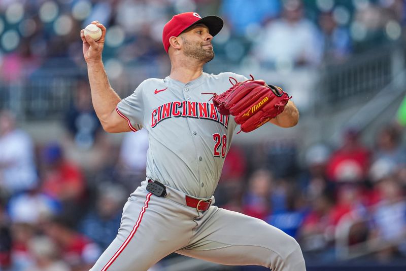 Sep 9, 2024; Cumberland, Georgia, USA; Cincinnati Reds starting pitcher Nick Martinez (28) pitches against the Atlanta Braves during the first inning at Truist Park. Mandatory Credit: Dale Zanine-Imagn Images