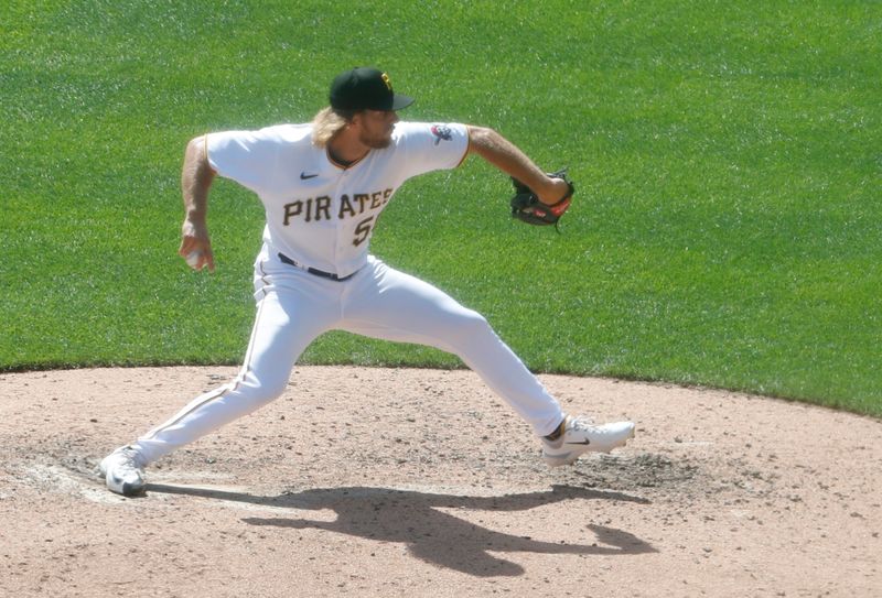 Sep 6, 2023; Pittsburgh, Pennsylvania, USA;  Pittsburgh Pirates relief pitcher Carmen Mlodzinski (50) pitches against the Milwaukee Brewers during the seventh inning at PNC Park. Pittsburgh won 5-4. Mandatory Credit: Charles LeClaire-USA TODAY Sports