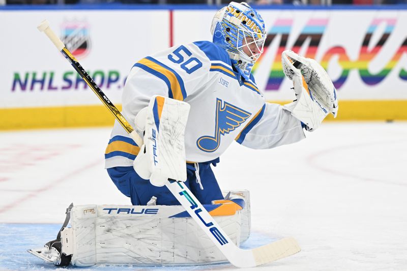 Nov 18, 2025; Toronto, Ontario, CAN;   St. Louis Blues goalie Jordan Binnington (50) makes a glove save as he warms up before playing the Toronto Maple Leafs at Scotiabank Arena. Mandatory Credit: Dan Hamilton-Imagn Images