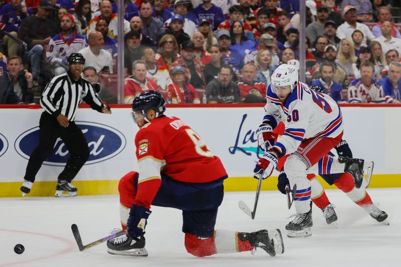 May 28, 2024; Sunrise, Florida, USA; New York Rangers left wing Will Cuylle (50) shoots the puck against the Florida Panthers during the first period in game four of the Eastern Conference Final of the 2024 Stanley Cup Playoffs at Amerant Bank Arena. Mandatory Credit: Sam Navarro-USA TODAY Sports