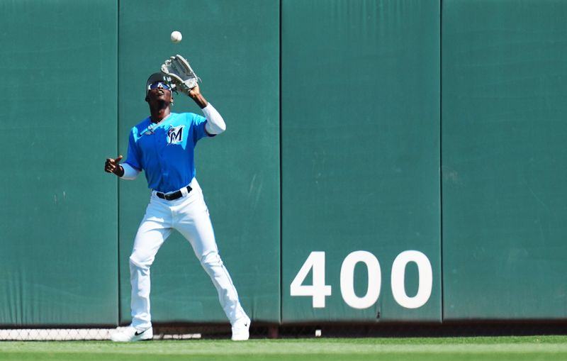 Mar 1, 2023; Jupiter, Florida, USA; Miami Marlins center fielder Jazz Chisholm Jr. (2) catches a fly ball for an out in the first inning against the New York Mets at Roger Dean Stadium. Mandatory Credit: Jim Rassol-USA TODAY Sports