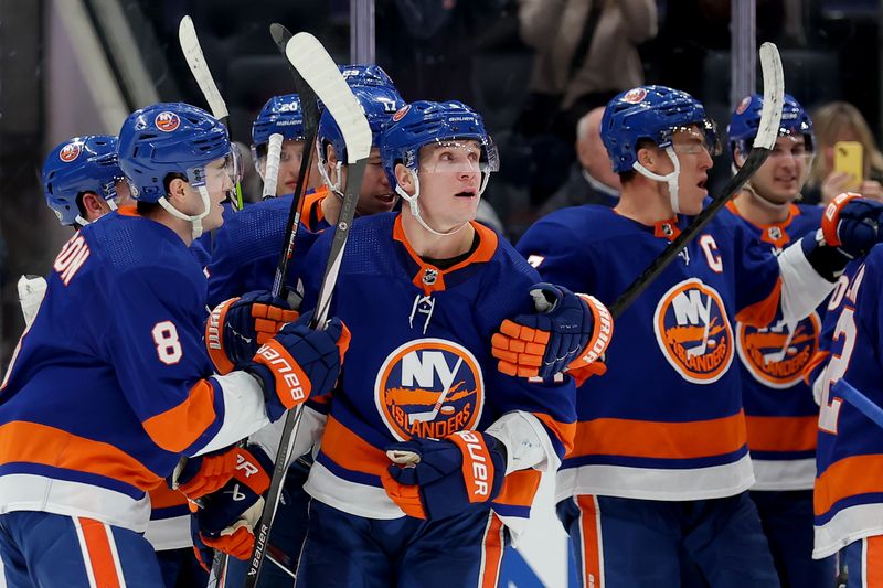 Jan 21, 2024; Elmont, New York, USA; New York Islanders center Bo Horvat (14) celebrates his game winning goal against the Dallas Stars with teammates during overtime at UBS Arena. Mandatory Credit: Brad Penner-USA TODAY Sports