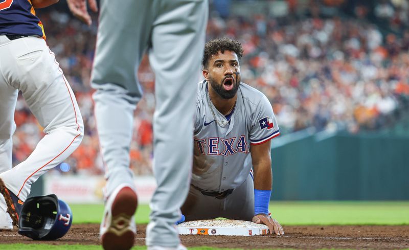 Apr 14, 2024; Houston, Texas, USA; Texas Rangers first baseman Ezequiel Duran (20) reacts after being thrown out at first base on a play during the seventh inning against the Houston Astros at Minute Maid Park. Mandatory Credit: Troy Taormina-USA TODAY Sports
