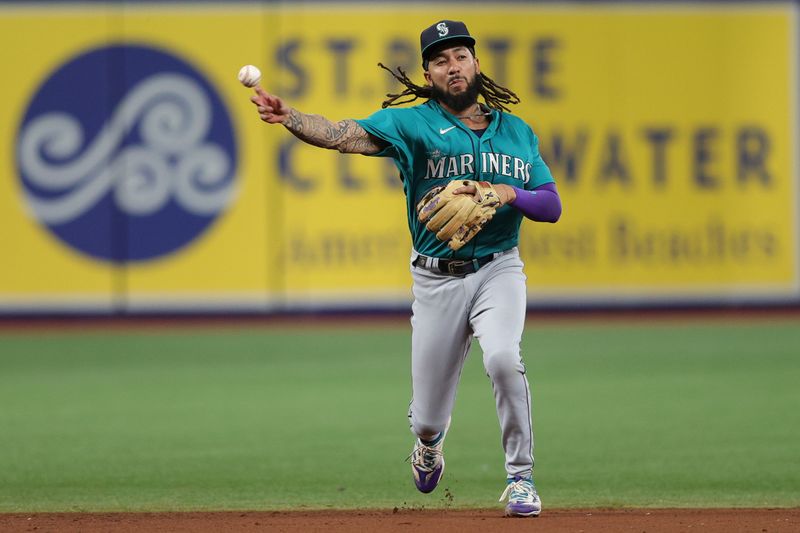 Sep 7, 2023; St. Petersburg, Florida, USA;  Seattle Mariners shortstop J.P. Crawford (3) throws to first for an out against the Tampa Bay Rays in the fifth inning at Tropicana Field. Mandatory Credit: Nathan Ray Seebeck-USA TODAY Sports