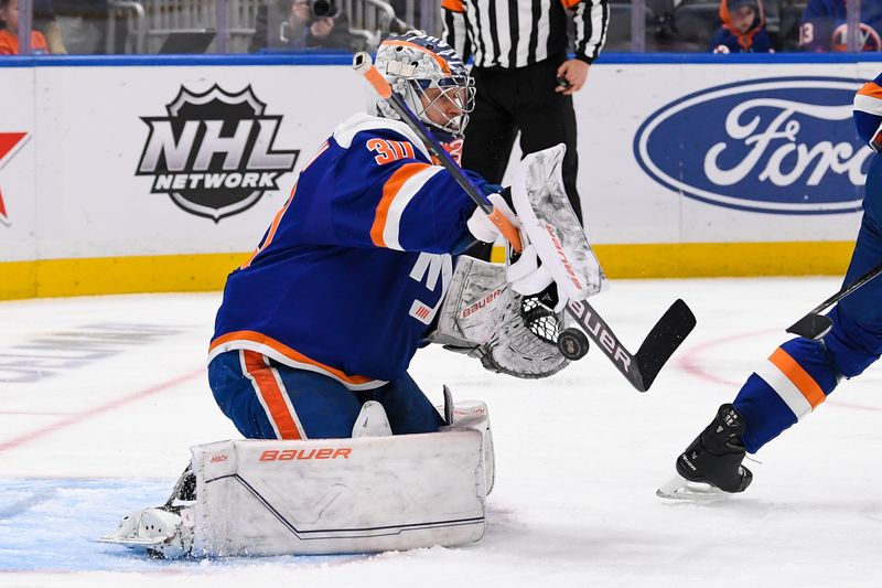 Apr 6, 2023; Elmont, New York, USA; New York Islanders goaltender Ilya Sorokin (30) makes a save against the Tampa Bay Lightning during the third period at UBS Arena. Mandatory Credit: Dennis Schneidler-USA TODAY Sports